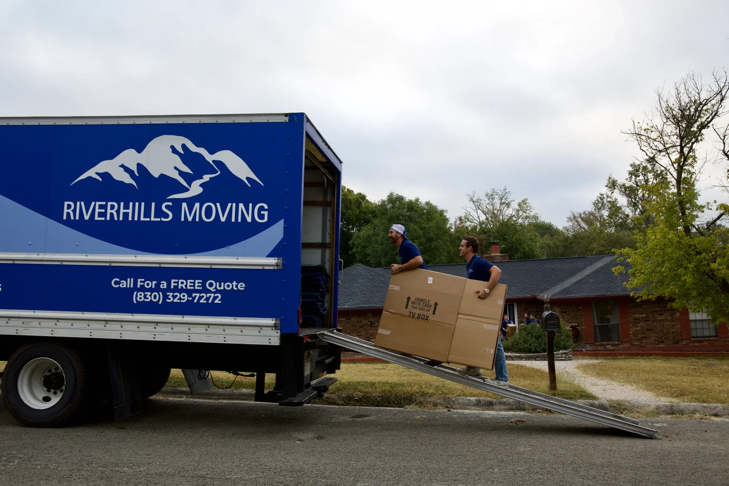 RiverHills Moving crew loading a branded truck